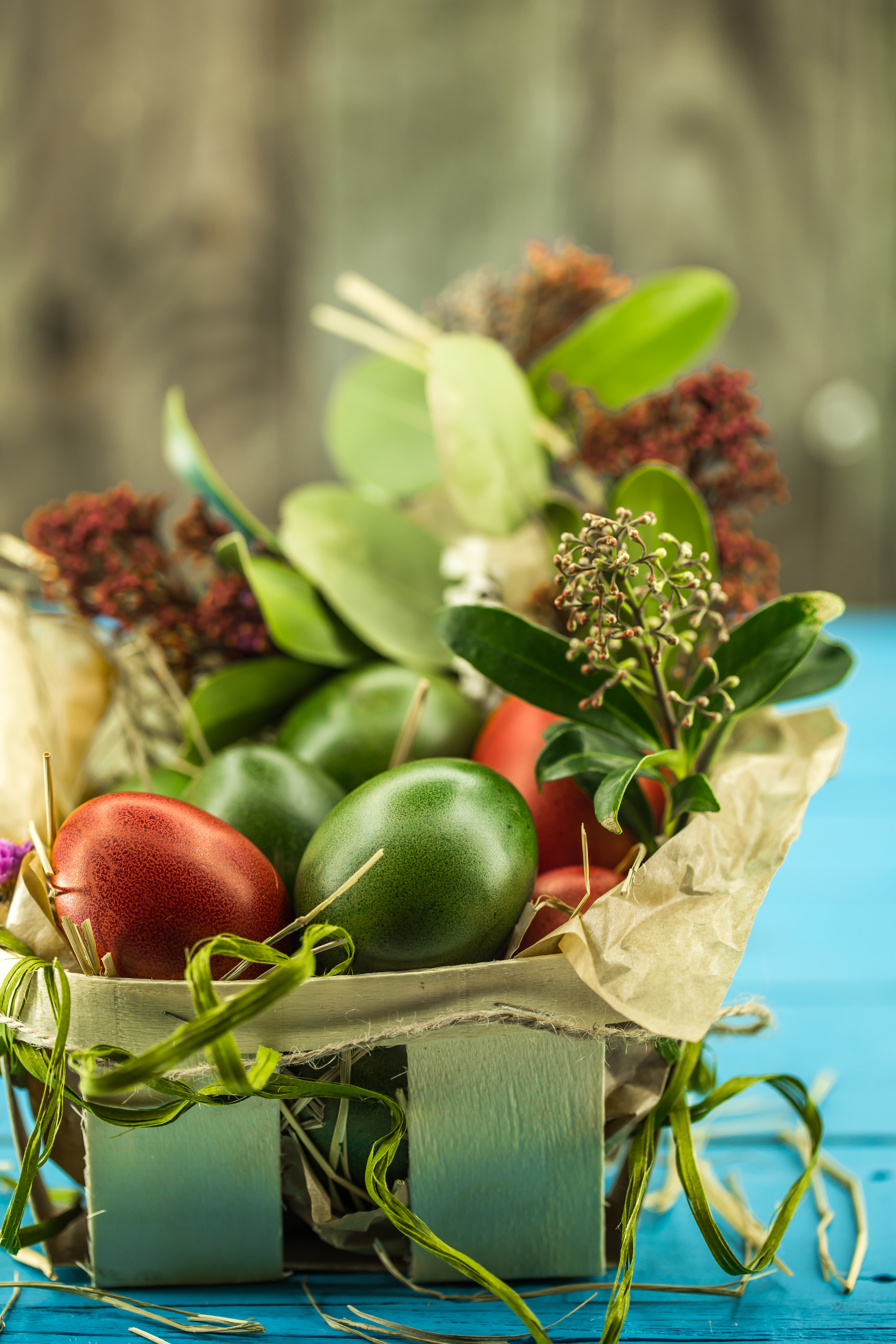beautiful easter eggs on a blue wooden background
